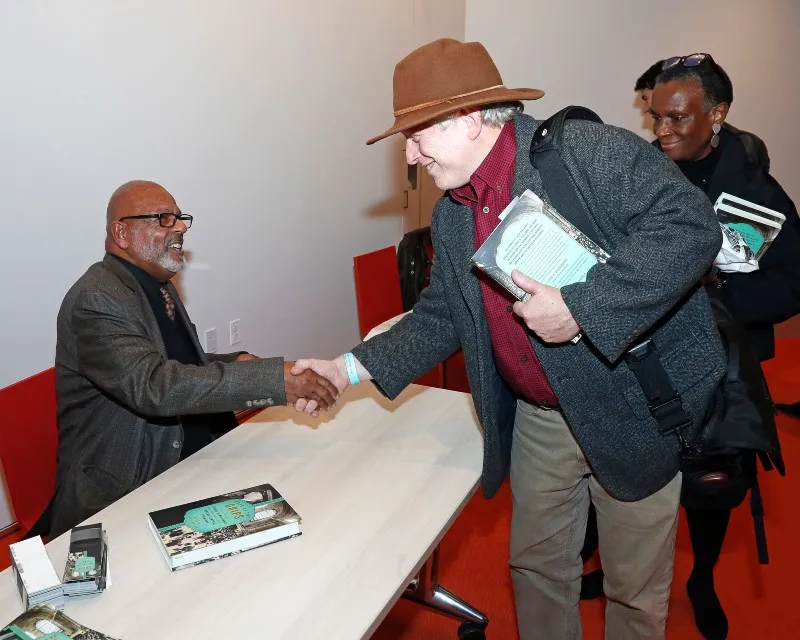 Eric K. Washington Shaking hands with Rob Snyder, Manhattan Borough Historian