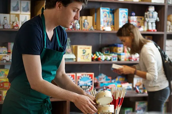 Man stocking a toy store
