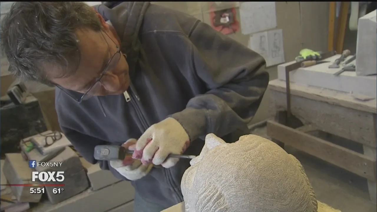 stone carver works on stones.