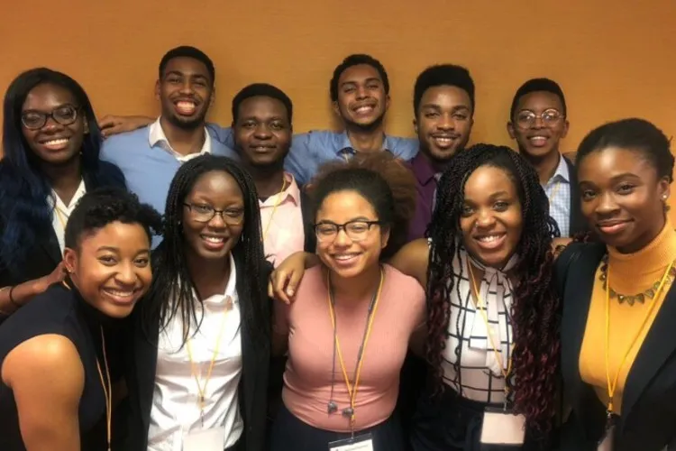 A group photo of 11 young men and women.