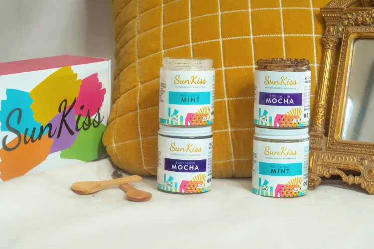 SunKiss Organics products in front of a orange pillow