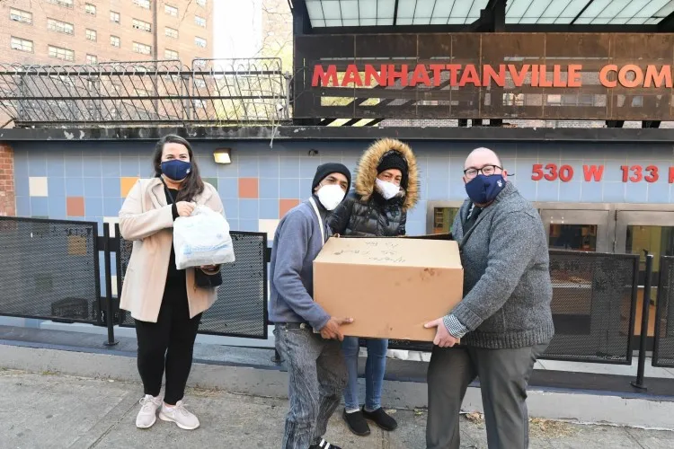 Facilities and Operations staff members safely deliver pre-Thanksgiving meals to local senior citizens. Photo Credit: Eileen Barroso