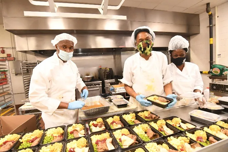 Chef Cornel of Cornel’s Catering Company with his team at Hot Bread Kitchen in East Harlem preparing 150 pre-Thanksgiving meals for local senior citizens. Photo Credit: Eileen Barroso