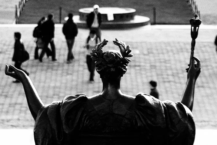 image taken behind alma mater statue in black/white