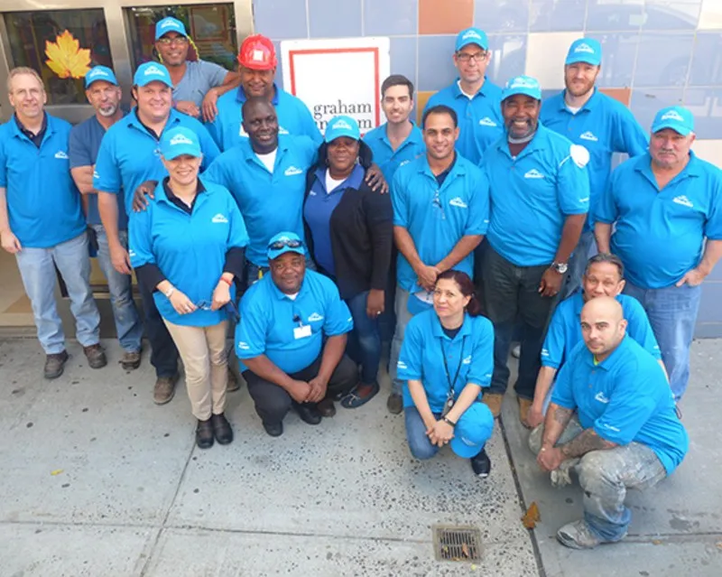 A group of volunteers smiling.