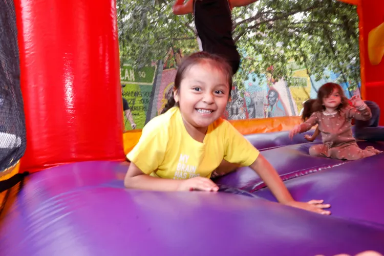Bouncy house fun at the 10th Annual 'Back-2-School' Block Party in Harlem. Photo Credit: Michael DiVito