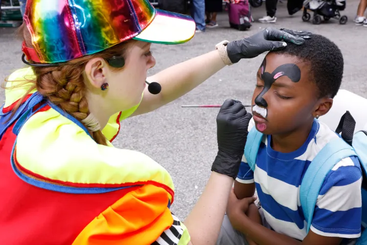 Face painting was one of the many fun-filled festivities at the back-to-school block party. Photo Credit: Michael DiVito