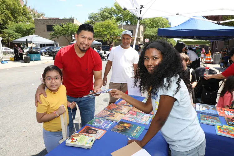 Local youth received free books, courtesy of Made for Me Books, at the 11th Annual "Back-2-School" Block Party in Harlem. Photo credit: Michael DiVito