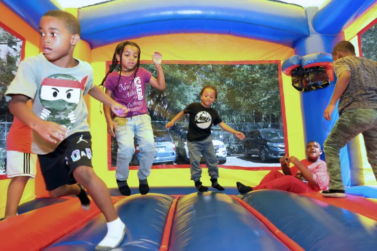 Bouncy house fun at the 11th Annual "Back-2-School" Block Party in Harlem. Photo credit: Michael DiVito