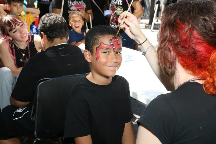 The face painting station was a popular attraction at the 11th Annual "Back-2-School" Block Party in Harlem. Photo credit: Michael DiVito