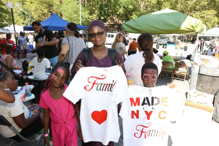 Attendees put their own creative spin on t-shirts at the 11th Annual "Back-2-School" Block Party in Harlem. Photo credit: Michael DiVito