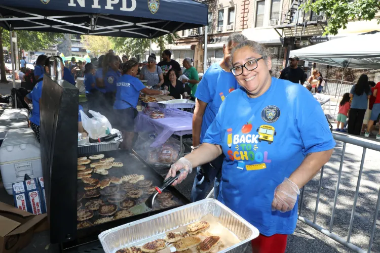 Volunteers dished up delicious eats at the 11th Annual "Back-2-School" Block Party in Harlem. Photo credit: Michael DiVito