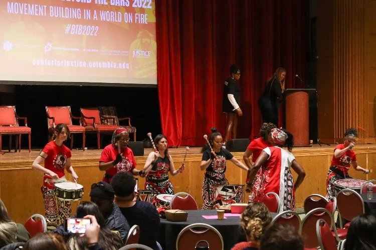Women playing drums.