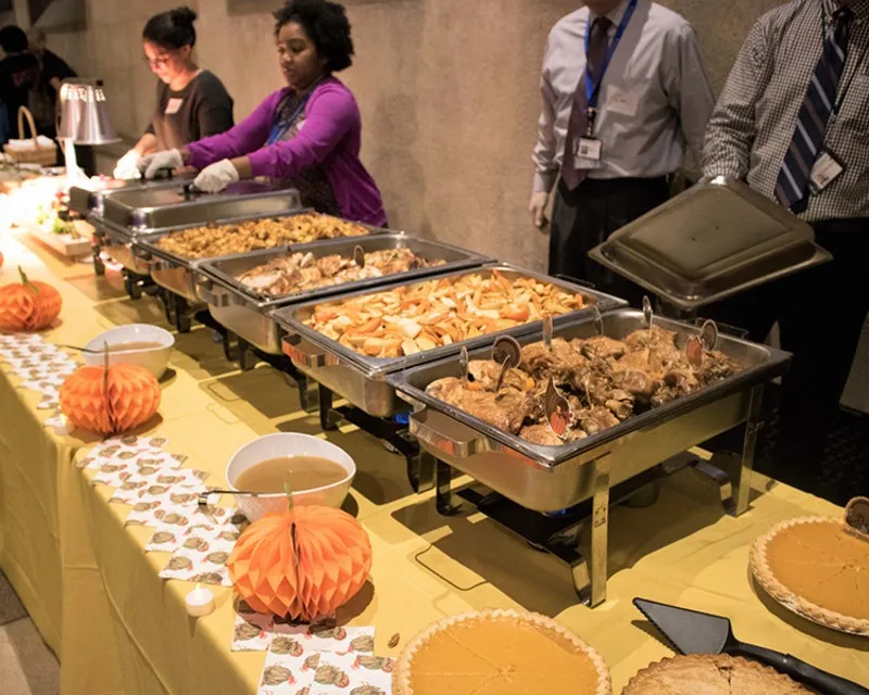 Volunteers serving food