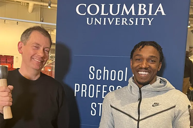 Columbia Bundles Scholar Chris Pellettieri, founder of the Pellettieri Stone Carving Academy (left), with Aboubacar Keita, alumnus and current intern with the Academy's Governors Island Mather Building Arts & Craftsmanship High School program in collaboration with National Park Service.