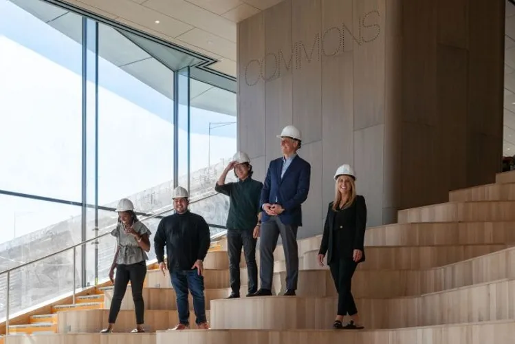 People in hard hats in building