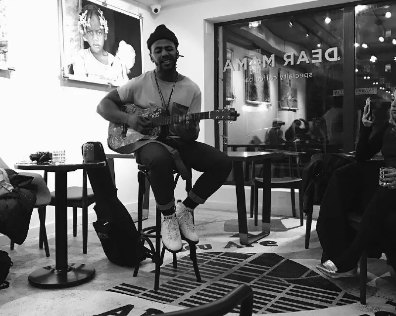 Guitar artist performing at Dear Mama Coffee