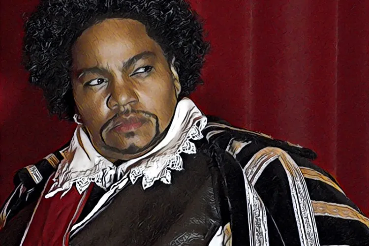 A woman dressed in a Shakespearean costume with a beard.