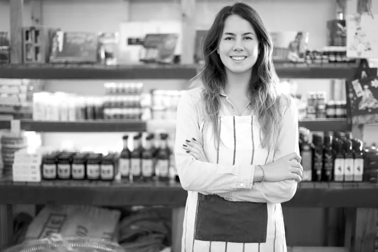 Woman smiling in a convenience store
