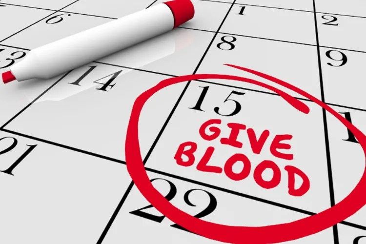 A calendar with one day circled in red and "give blood" written on that day.