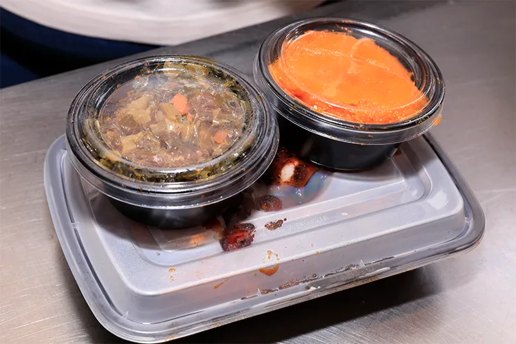 Boxes of food from Dinosaur Bar-B-Que.
