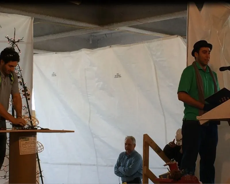 Two men on stage performing.