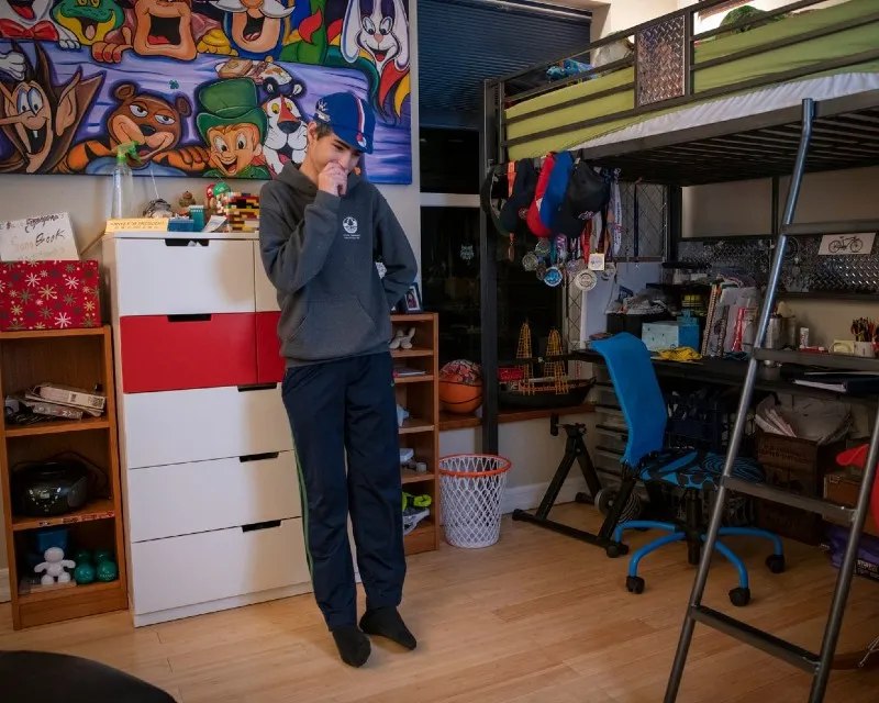 Child standing in a kids room.