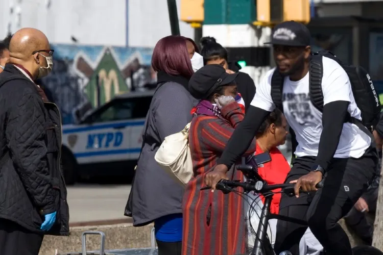 photo of people on a street with nypd car in background