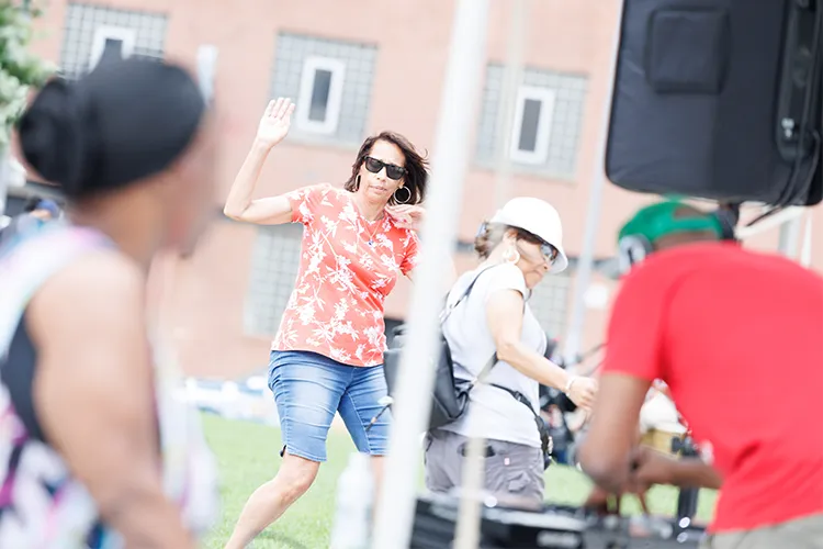 A group dances to the sweet tunes of DJ Stormin' Norman at Manhattanville Community Day on June 8, 2024. Photo by Sirin Samman.