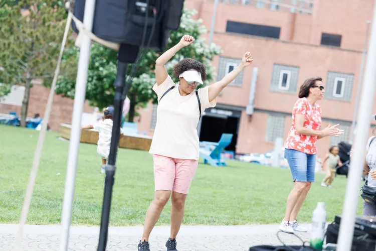 A Manhattanville Community Day attendee enjoying the festive summer celebration. Photo credit: Sirin Samman