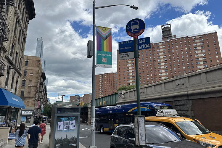 A cityscape with a MorningPride banner.