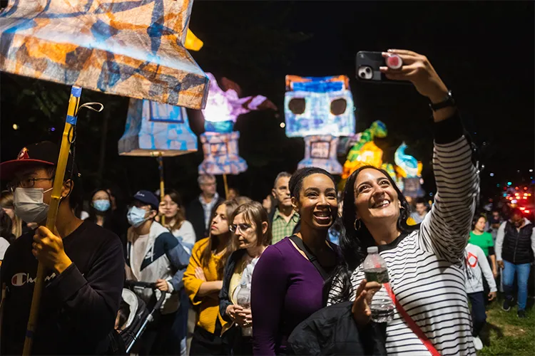 Two friends take a selfie at the Morningside Lights processional on September 24, 2022. 