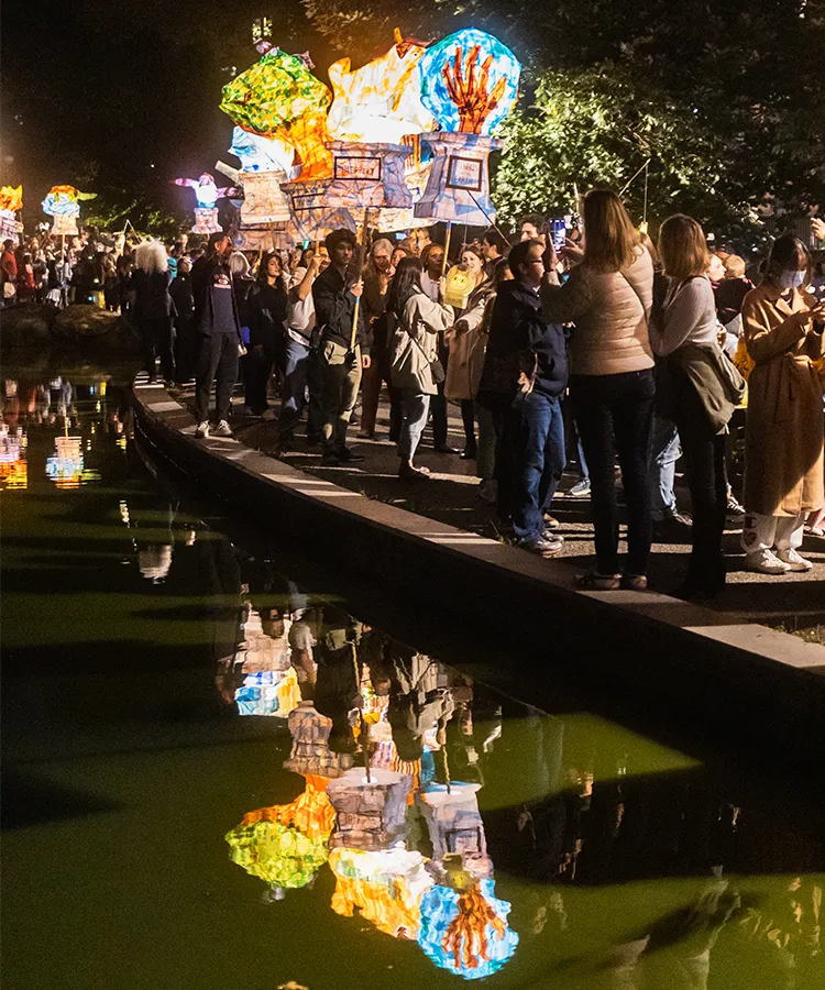 Participants with lanterns in Morningside Park