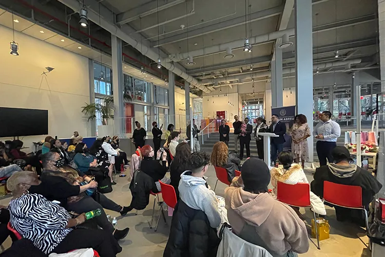 A group of people listen to Council Member Shaun Abreu speak at The Forum. Courtesy Kate Nemetz