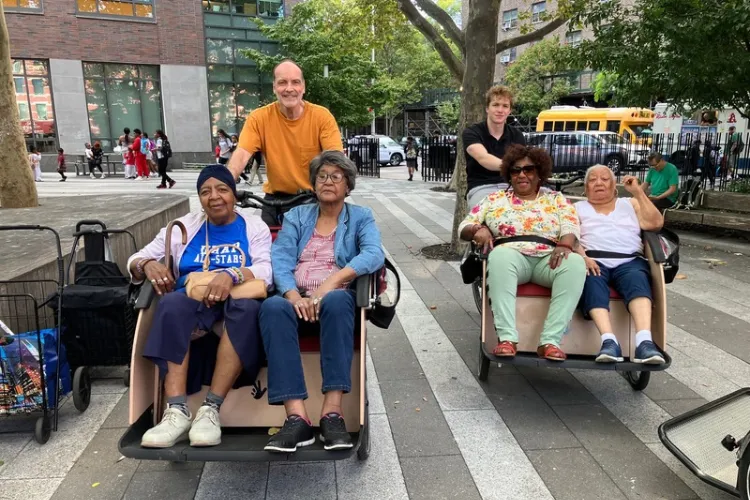 East Harlem elders enjoying trishaw rides as part of New Paths Nuevos Caminos Inc.’s Cycling Without Age program. Photo credit: Chris Lawrence