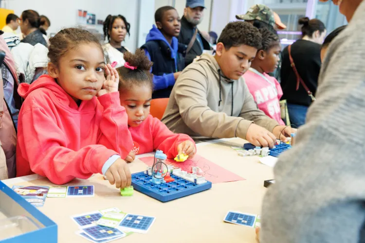 Youth enjoying the interactive electricity demonstrations at the Saturday Science workshop. Photo credit: Sirin Samman